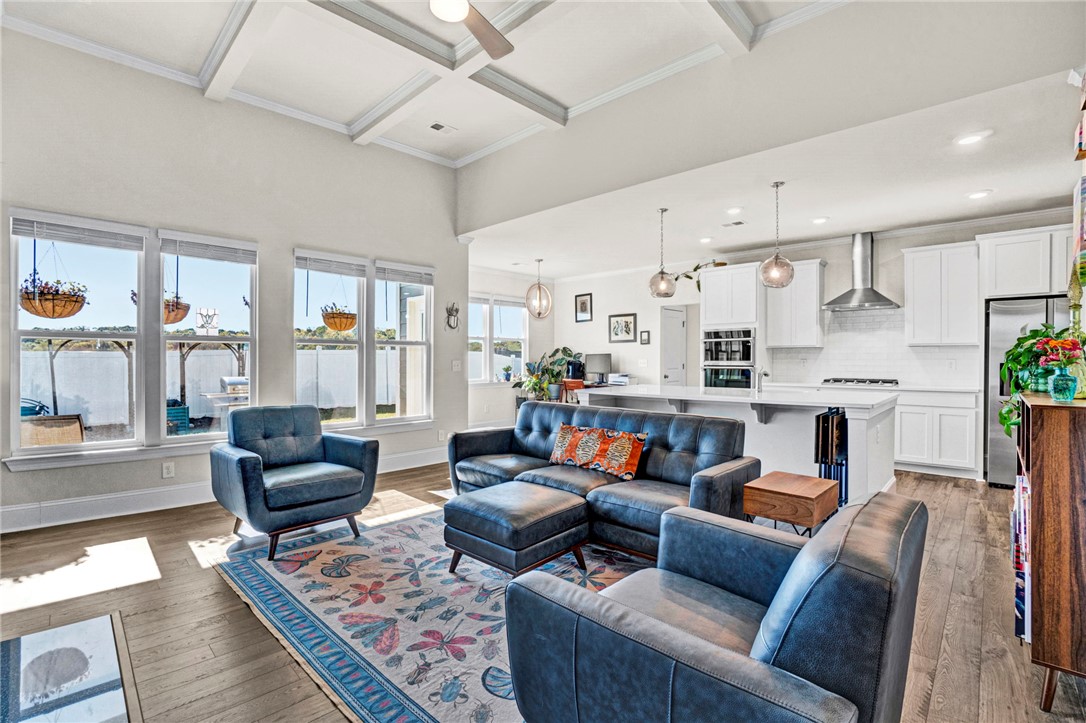 142 Juniper Hill Drive Easley, SC 29642 - Photo 22 of 47 This bright living space showcases a modern open-concept design and ample natural light.