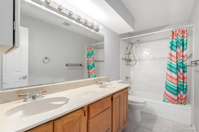 a bathroom with a sink a vanity and a mirror