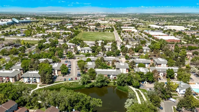 an aerial view of residential building and lake