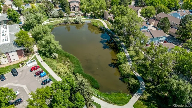 an aerial view of residential house with outdoor space and lake view