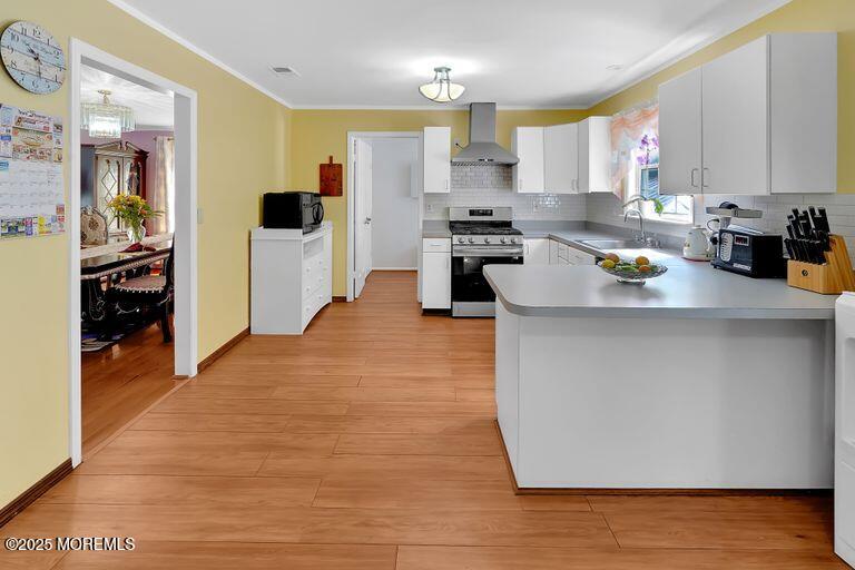 389 Aldrich Road Howell, NJ 07731 - Photo 13 of 55 a kitchen with stainless steel appliances a stove refrigerator sink and cabinets