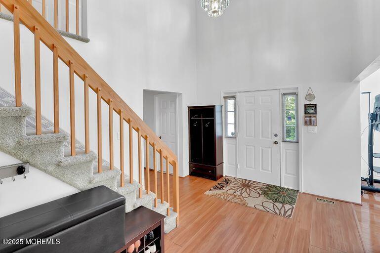 389 Aldrich Road Howell, NJ 07731 - Photo 2 of 55 a view of entryway with wooden floor and stairs