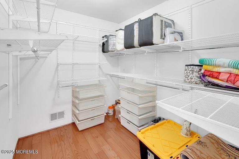 389 Aldrich Road Howell, NJ 07731 - Photo 26 of 55 a view of walk in closet with empty racks