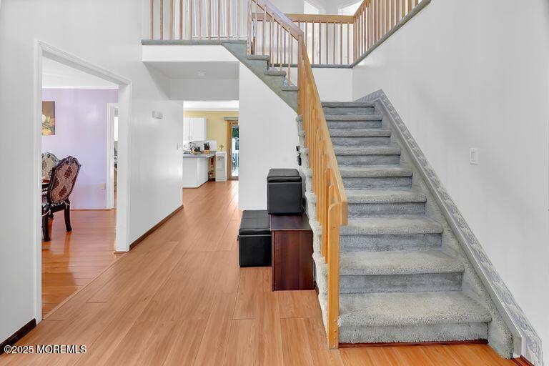 389 Aldrich Road Howell, NJ 07731 - Photo 3 of 55 a view of entryway and hall with wooden floor