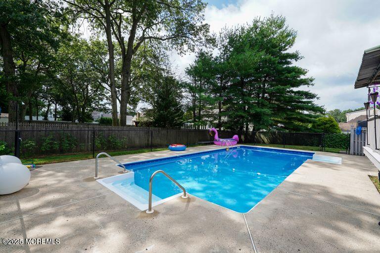 389 Aldrich Road Howell, NJ 07731 - Photo 44 of 55 a view of swimming pool with a patio