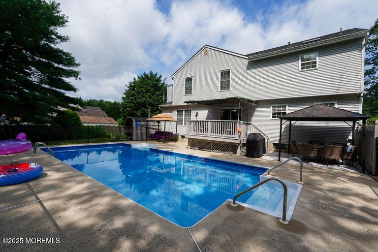 389 Aldrich Road Howell, NJ 07731 - Photo 46 of 55 a view of a house with pool and sitting area