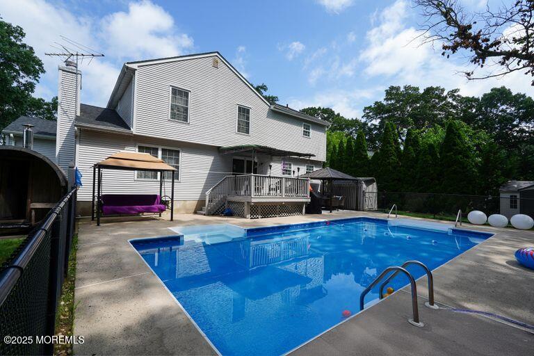 389 Aldrich Road Howell, NJ 07731 - Photo 48 of 55 a house view with a sitting space fire pit and outdoor space