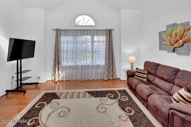 389 Aldrich Road Howell, NJ 07731 - Photo 7 of 55 a living room with furniture and a flat screen tv