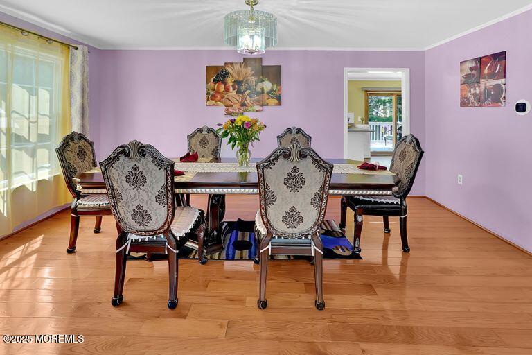 389 Aldrich Road Howell, NJ 07731 - Photo 8 of 55 a view of a dining room with furniture and wooden floor