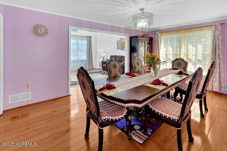 389 Aldrich Road Howell, NJ 07731 - Photo 9 of 55 a view of a dining room with furniture window and wooden floor