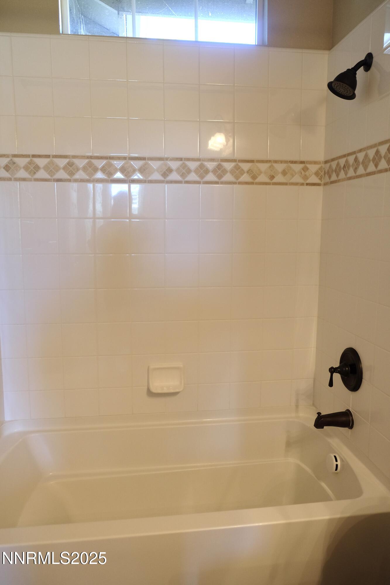 11039 Lamour Lane Reno, NV 89521 - Photo 13 of 25 a bathroom with a bathtub