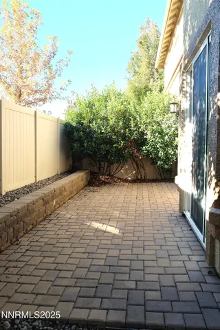 a view of a backyard of the house