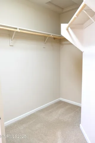 a view of an empty walk in closet
