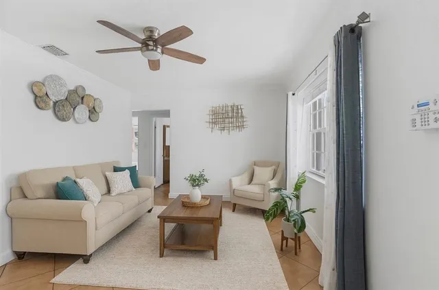 a living room with furniture and a window