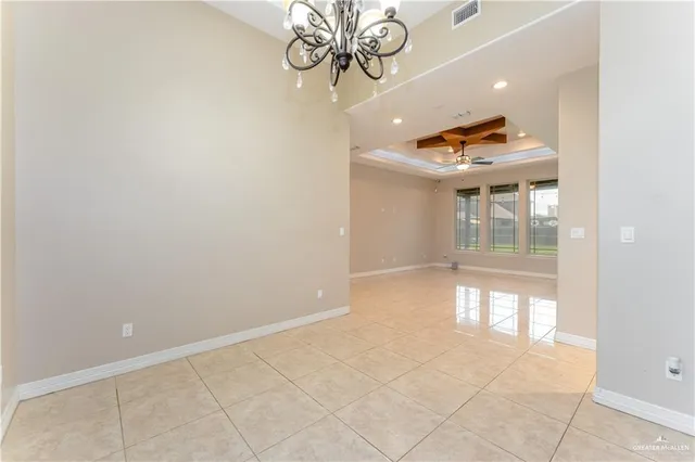 a large kitchen with granite countertop a large counter top and cabinets