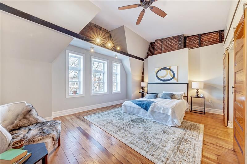 232 South Mathilda Street Friendship Park, PA 15224 - Photo 17 of 25 Retreat to the 3rd level to find your master suite. I mean really, what more can you ask for?! Exposed beams, more expsoed brick, the windows... (insert heart eye emoji)