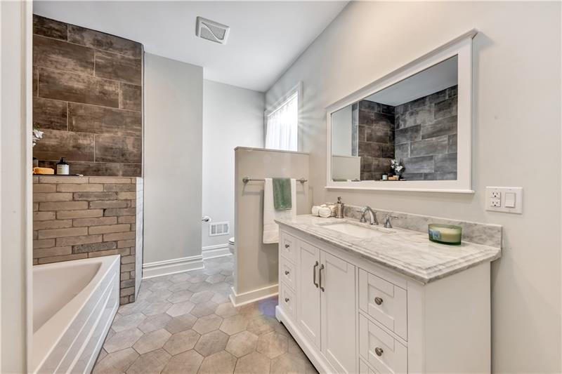 232 South Mathilda Street Friendship Park, PA 15224 - Photo 22 of 25 Another remodeled bathroom on the "main" level of this 3-story home. Wait until you see the light fixture that is in here!