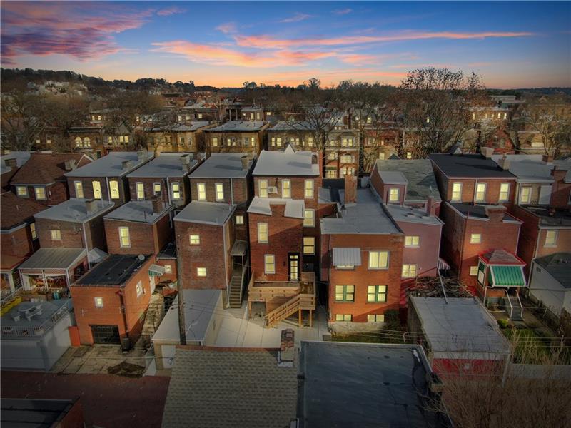 232 South Mathilda Street Friendship Park, PA 15224 - Photo 24 of 25 Drone shot showing off 232 S Mathilda's off-street parking, deck & NEW (2019) roof