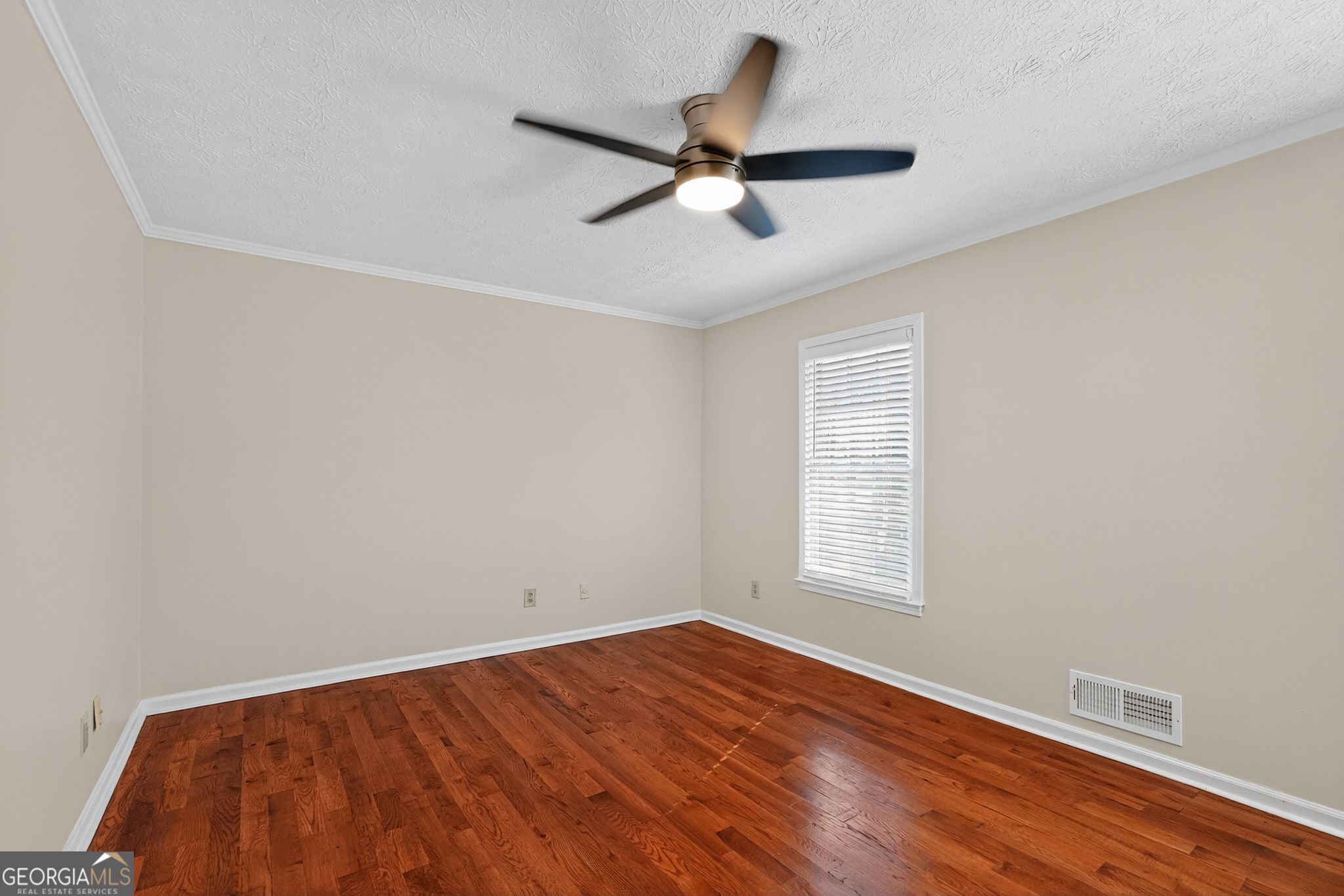 898 Chippendale Lane Norcross, GA 30093 - Photo 11 of 18 a view of empty room with wooden floor and fan