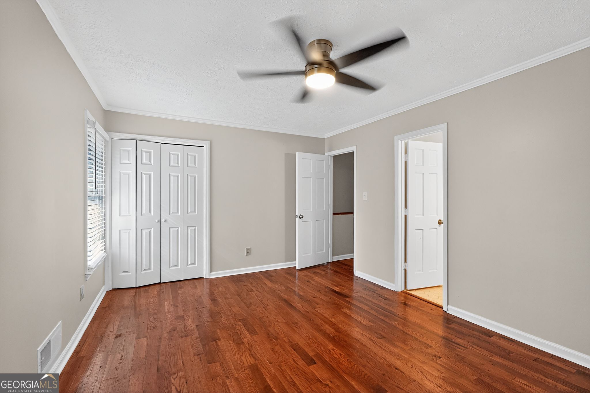 898 Chippendale Lane Norcross, GA 30093 - Photo 12 of 18 wooden floor in an empty room with a window