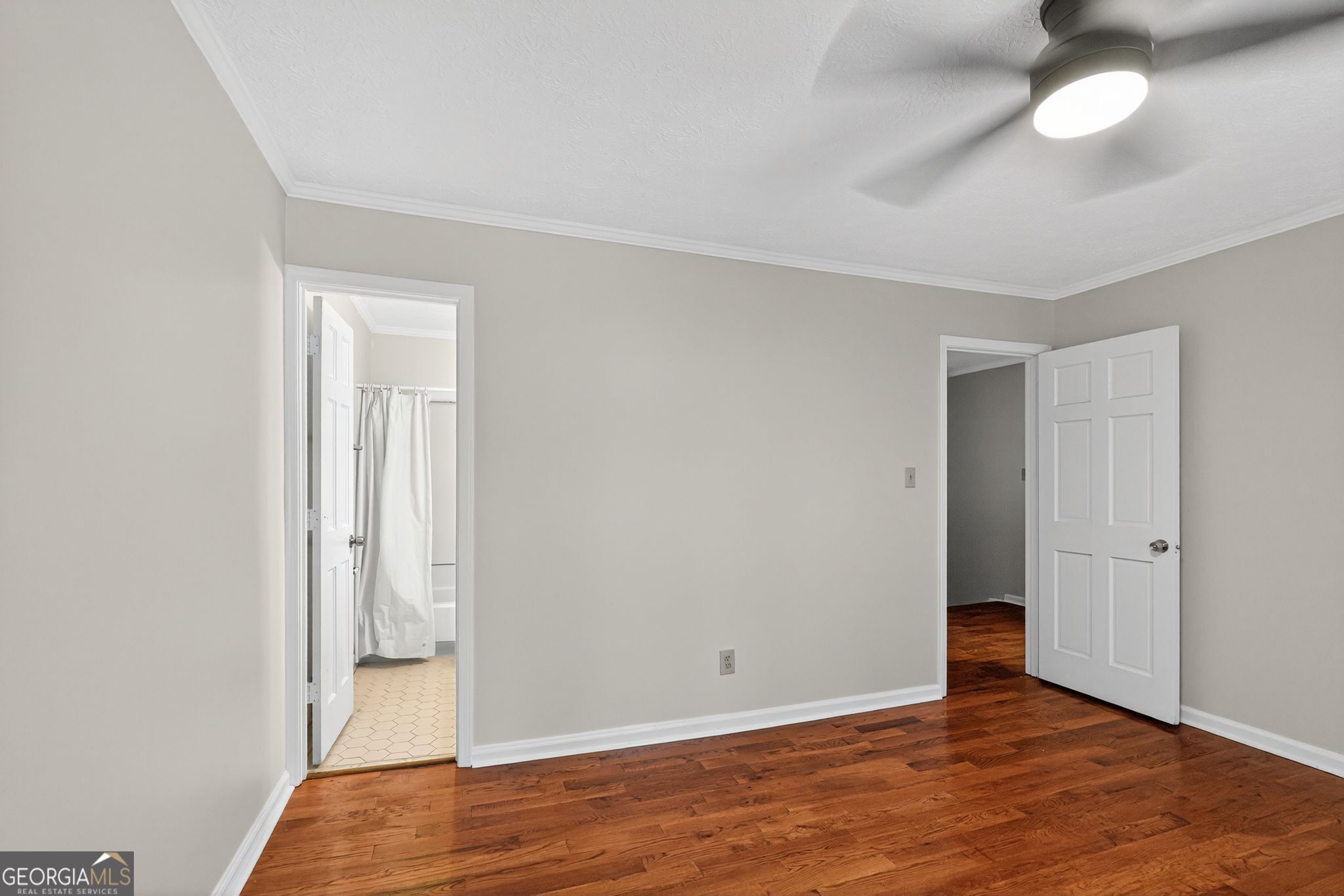 898 Chippendale Lane Norcross, GA 30093 - Photo 14 of 18 a view of an empty room with wooden floor