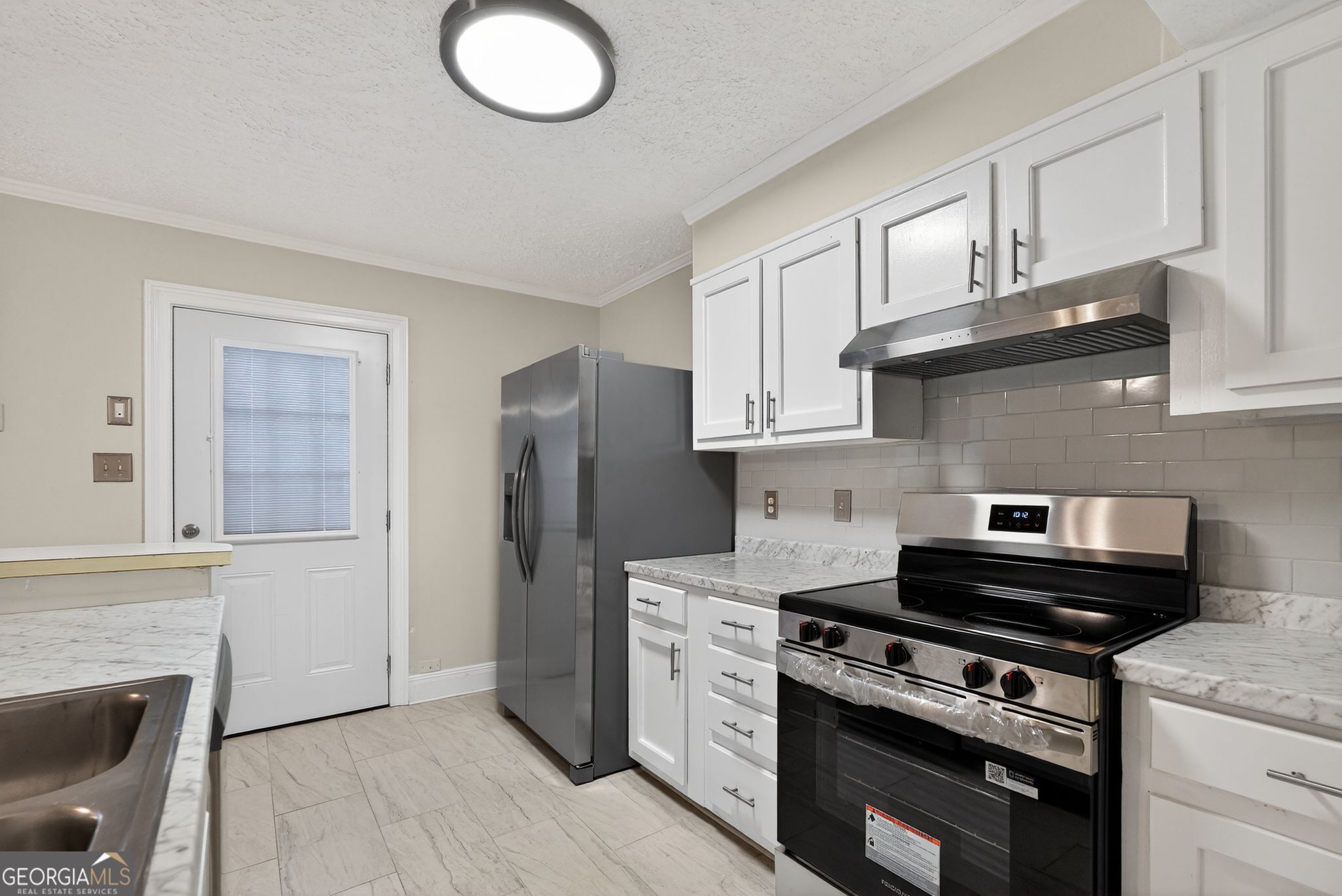 898 Chippendale Lane Norcross, GA 30093 - Photo 4 of 18 a kitchen with cabinets and steel stainless steel appliances