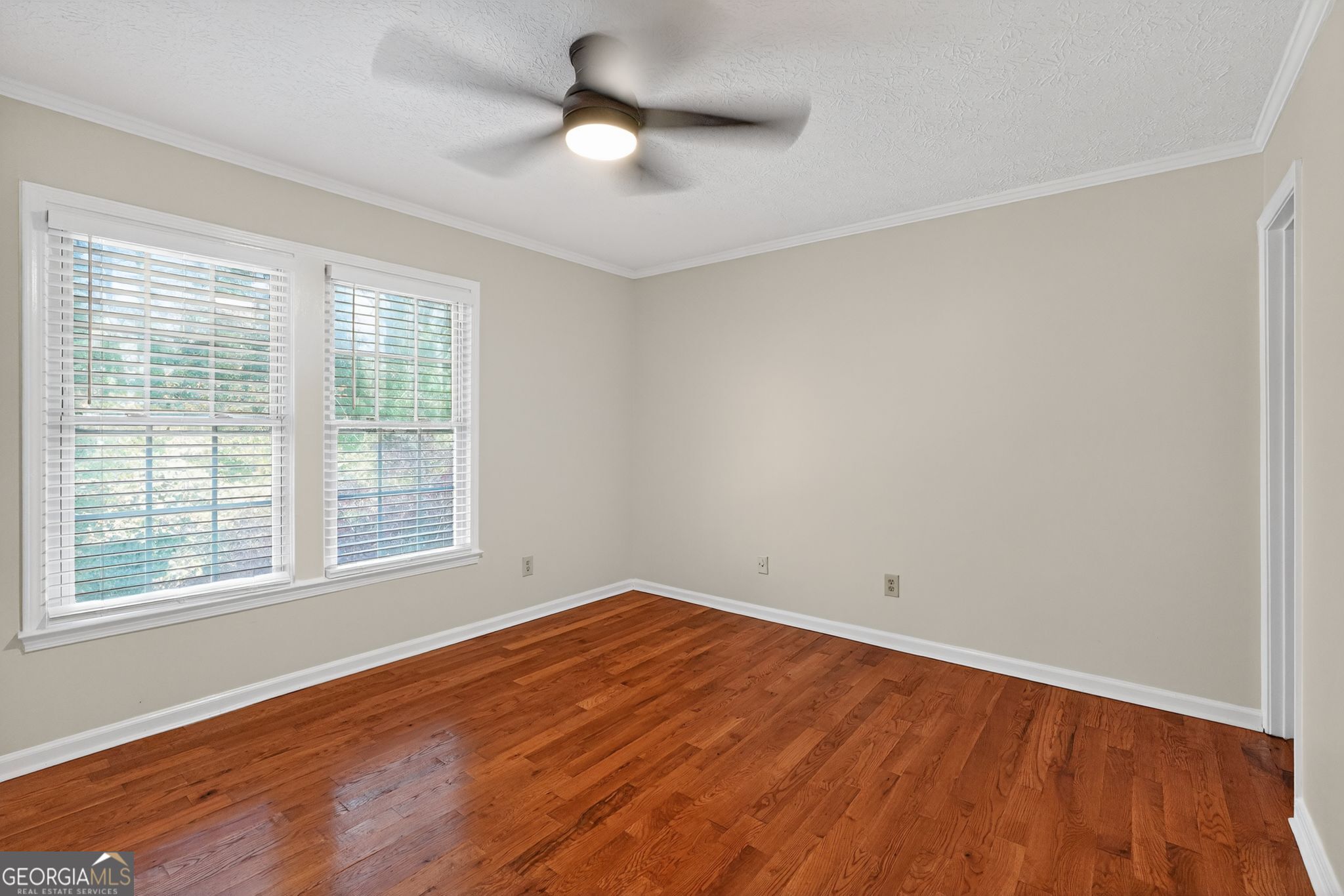 898 Chippendale Lane Norcross, GA 30093 - Photo 10 of 18 wooden floor in an empty room with a window