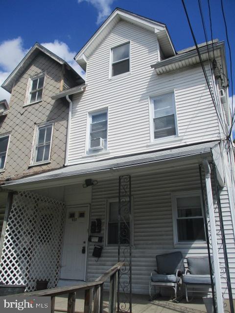a front view of a house with balcony