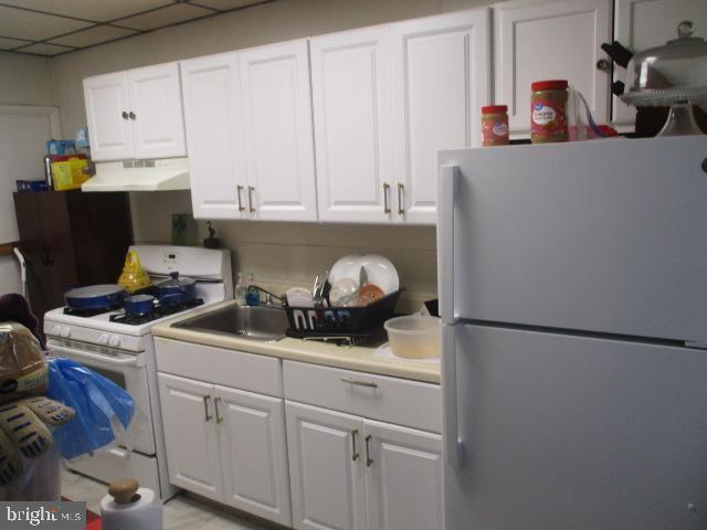 957 Springfield Road Darby, PA 19023 - Photo 14 of 42 a kitchen with a cabinets and appliances