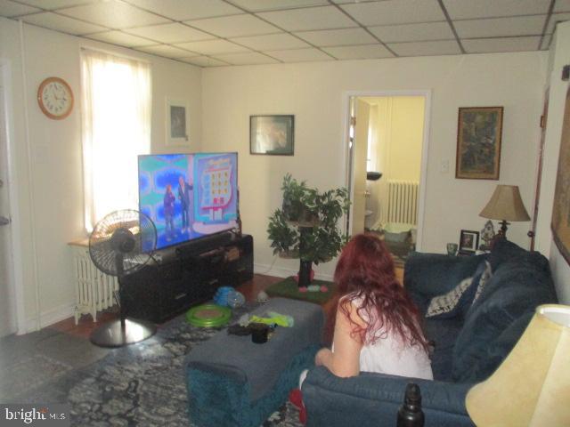 957 Springfield Road Darby, PA 19023 - Photo 19 of 42 a living room with furniture and a fireplace