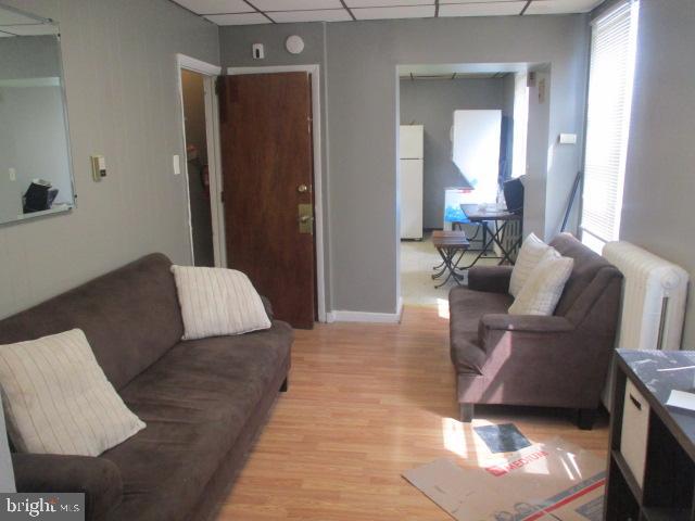 957 Springfield Road Darby, PA 19023 - Photo 28 of 42 a living room with furniture rug and a window