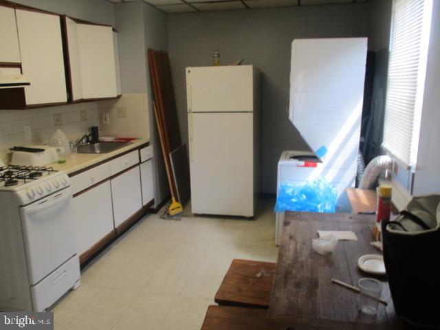 957 Springfield Road Darby, PA 19023 - Photo 31 of 42 a kitchen with stainless steel appliances granite countertop a sink stove and refrigerator