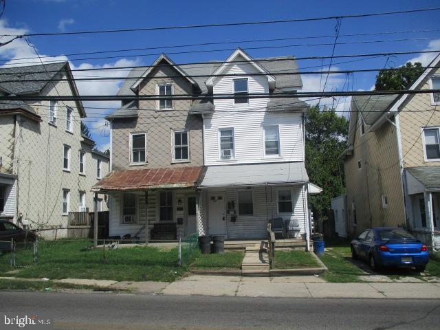 957 Springfield Road Darby, PA 19023 - Photo 36 of 42 a front view of a house with a garden