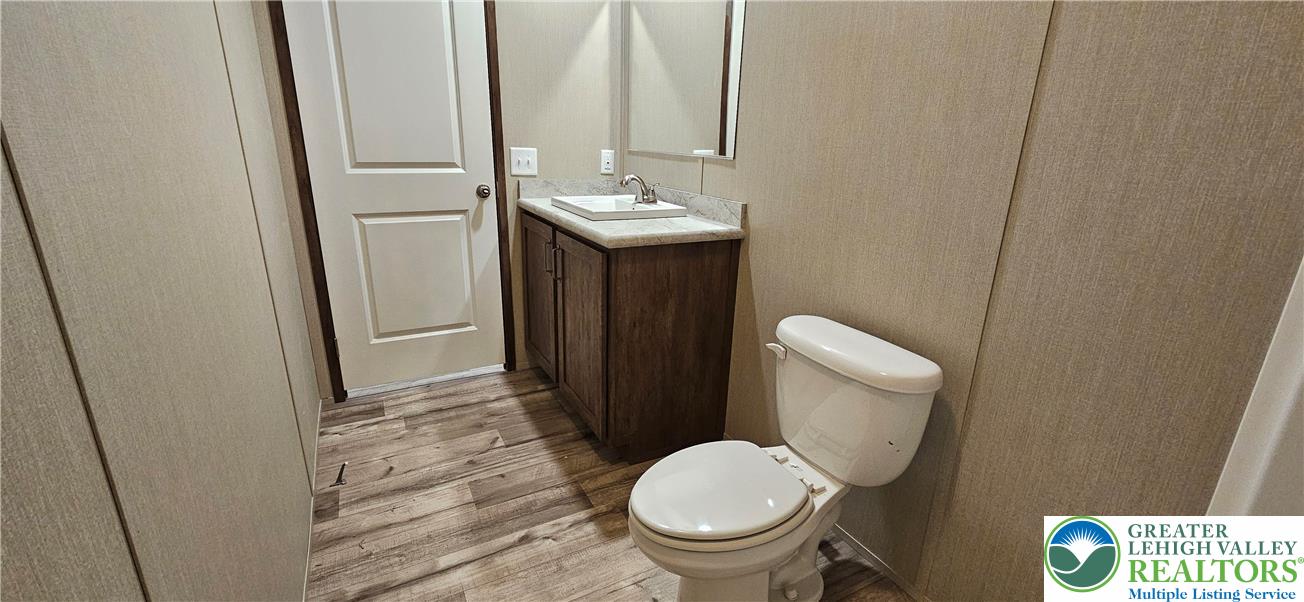 2501 Fox Road Bath, PA 18014 - Photo 10 of 11 a bathroom with a sink a toilet and a mirror