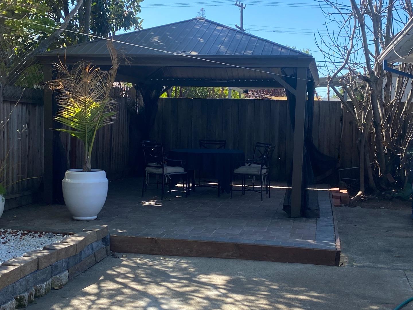 1312 Carleton Drive Concord, CA 94518 - Photo 15 of 16 a view of a backyard with table and chairs and potted plants