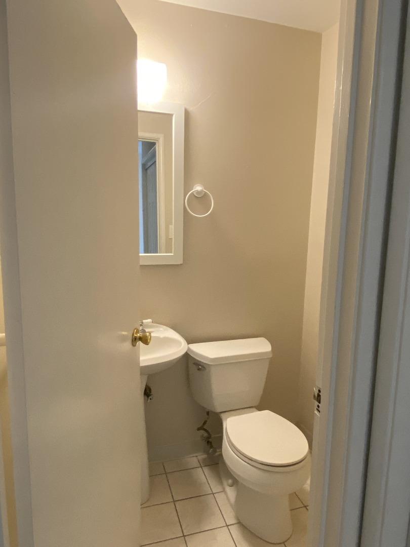 1312 Carleton Drive Concord, CA 94518 - Photo 10 of 16 a white toilet sitting next to a bathroom sink