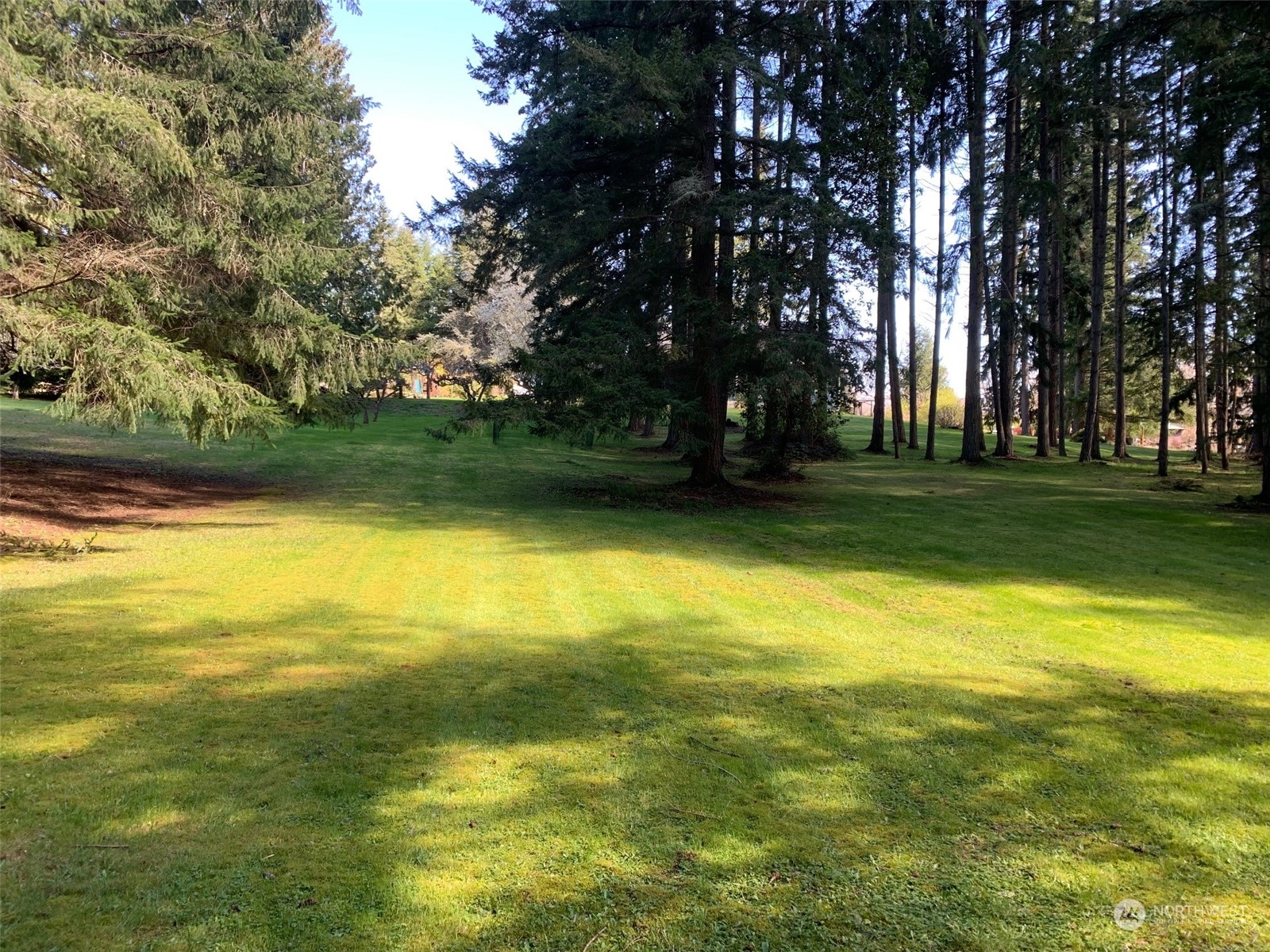 7755 Finch Road Northeast Bainbridge Island, WA 98110 - Photo 16 of 25 a view of a swimming pool with an outdoor space and seating area