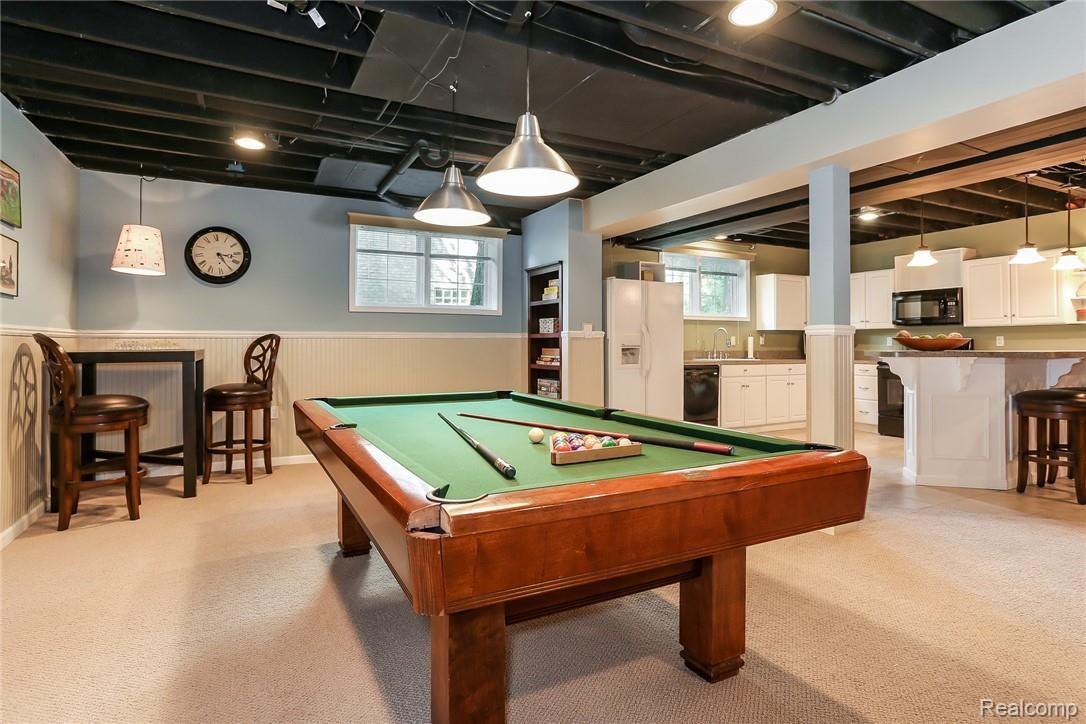 3758 Sleepy Fox Drive Rochester, MI 48309 - Photo 54 of 66 Built in cabinet is great for storing games or use the high top table for a game of chess