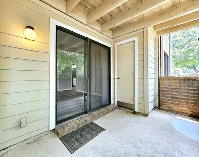 a view of a entryway door of the room