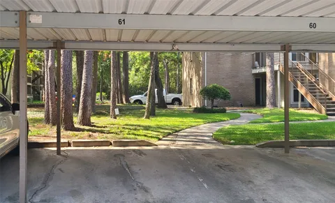a view of a house with backyard porch and sitting area