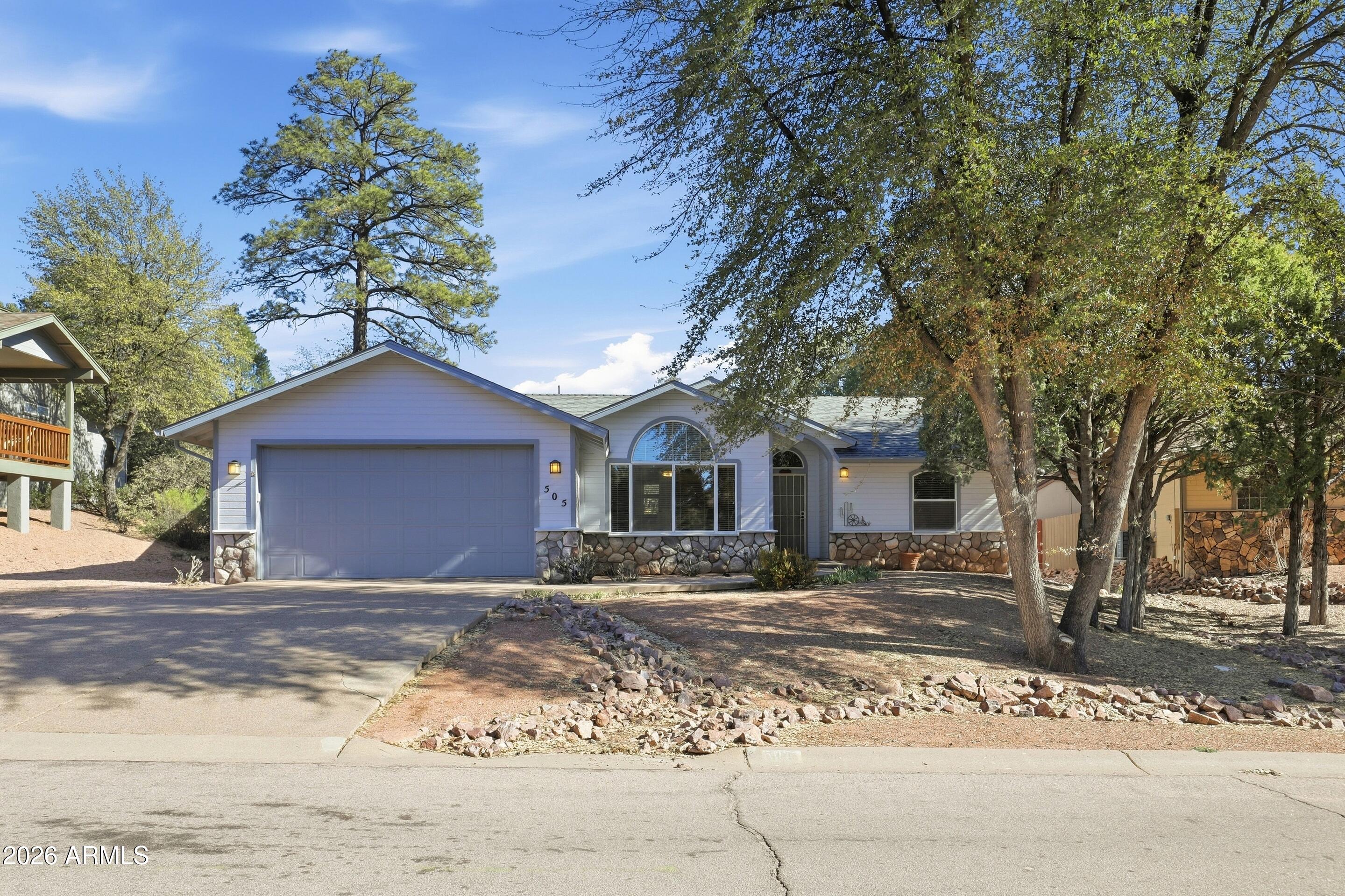 505 North Wood Hill Road Payson, AZ 85541 - Photo 21 of 26 a front view of a house with a yard
