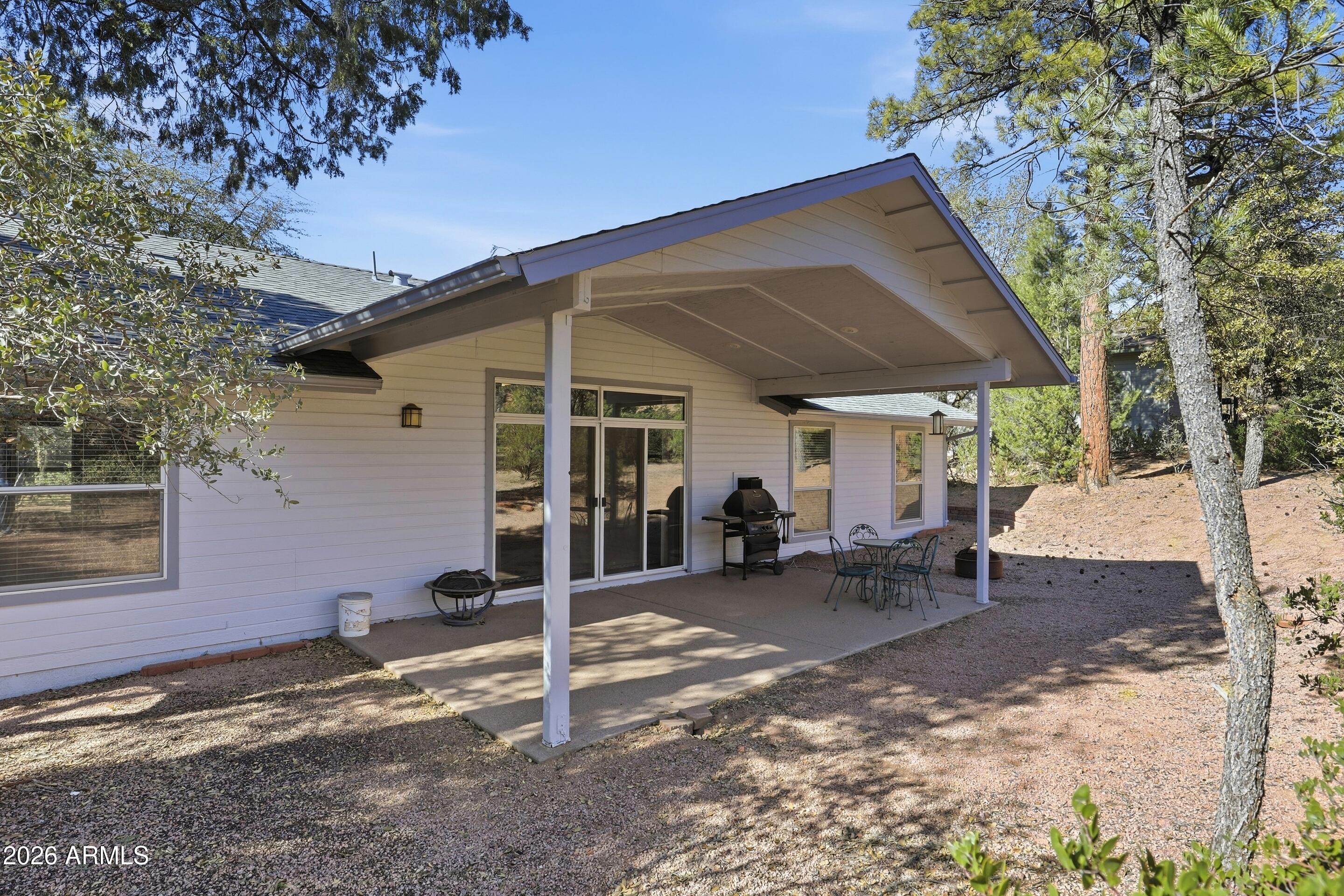 505 North Wood Hill Road Payson, AZ 85541 - Photo 23 of 26 a view of a house with backyard and sitting area