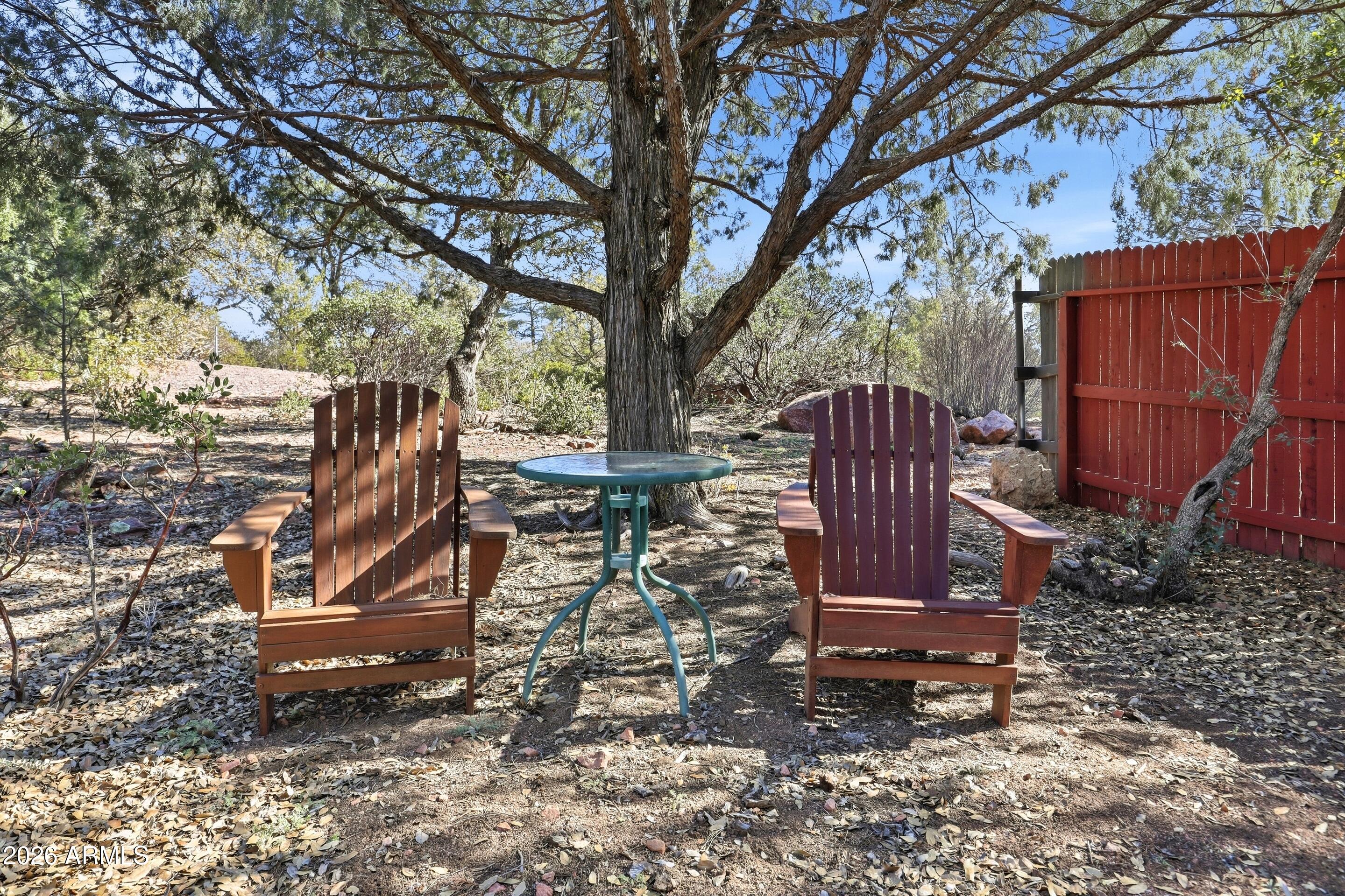 505 North Wood Hill Road Payson, AZ 85541 - Photo 25 of 26 a view of a backyard with wooden fence and a large tree