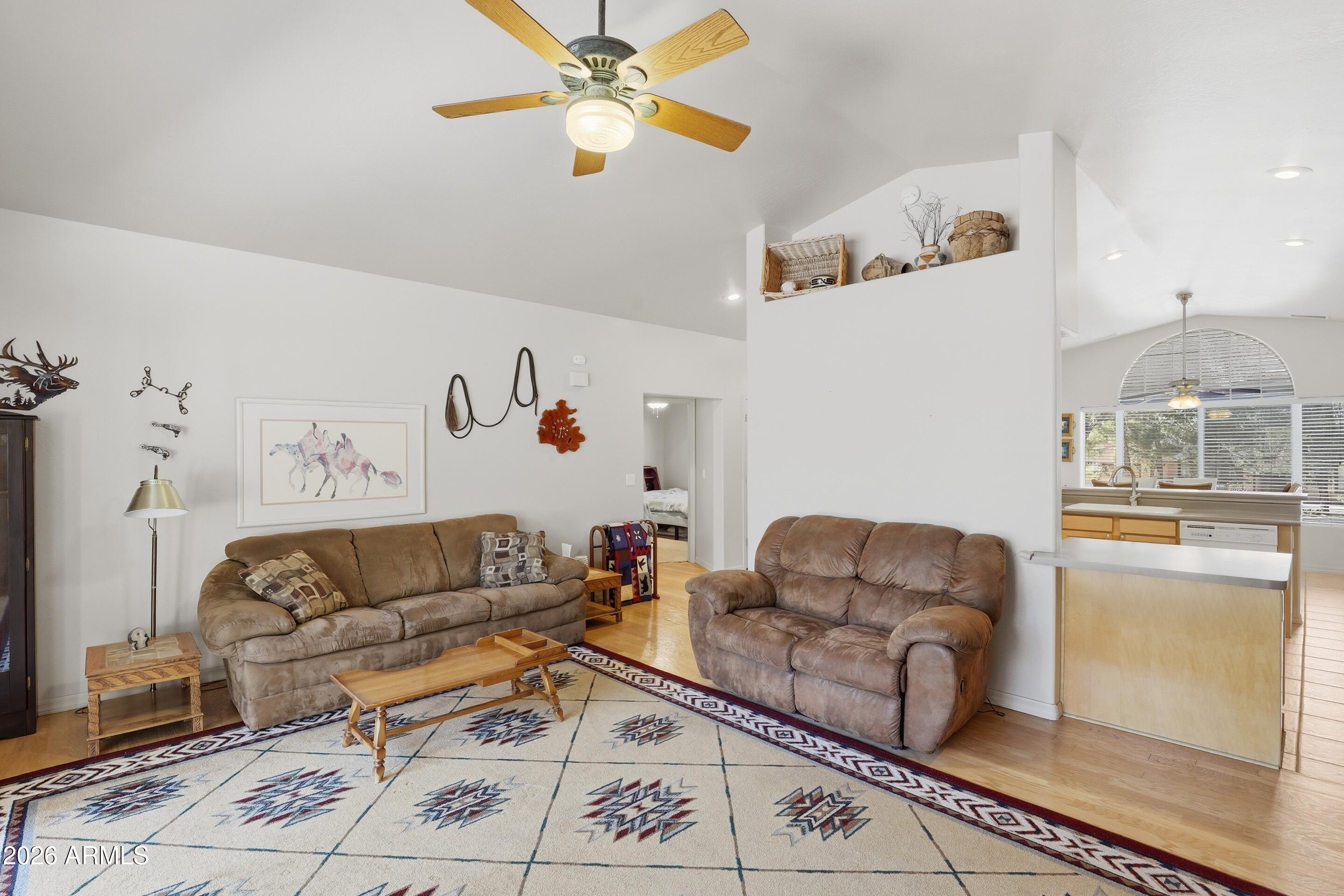 505 North Wood Hill Road Payson, AZ 85541 - Photo 4 of 26 a living room with furniture and a chandelier