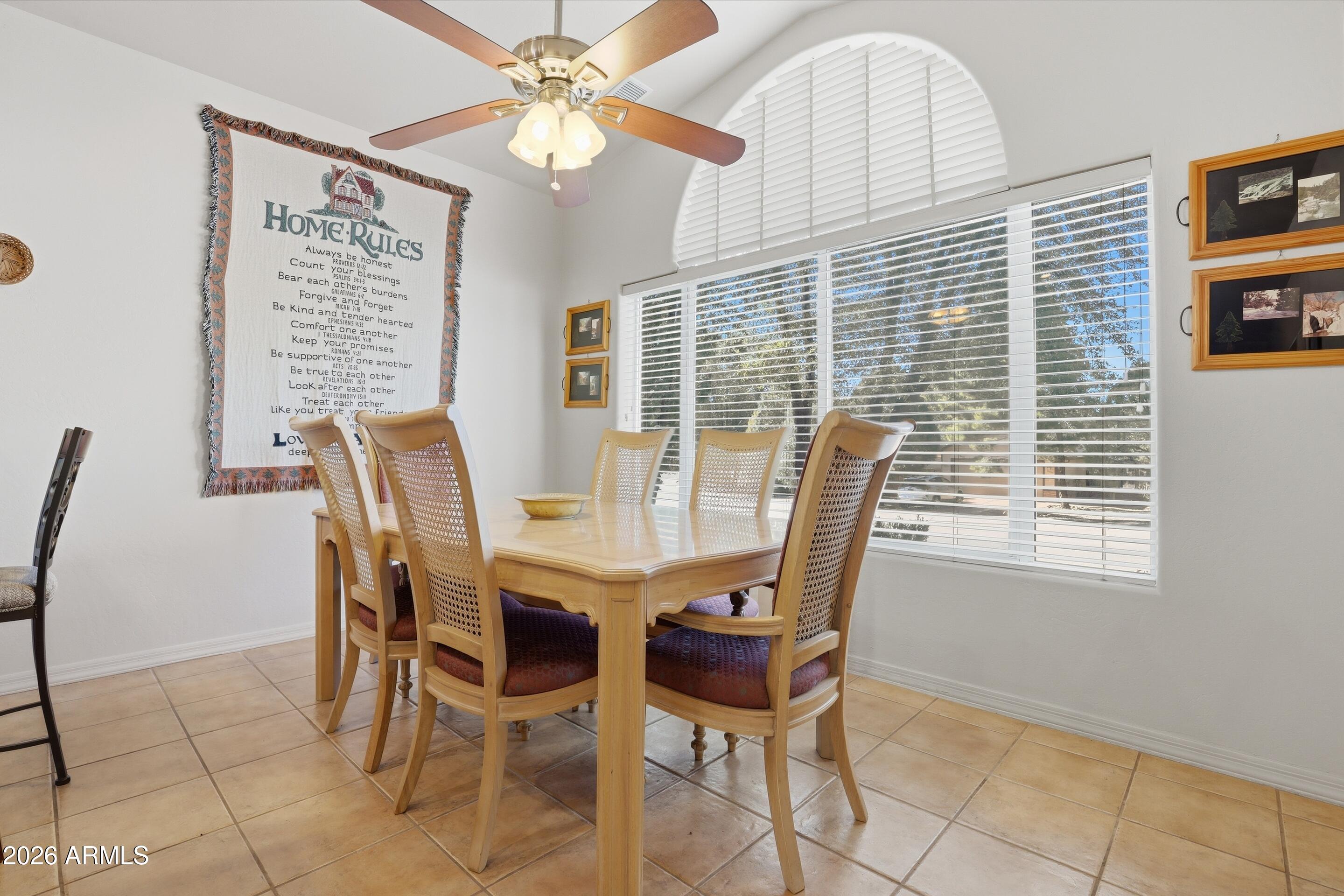 505 North Wood Hill Road Payson, AZ 85541 - Photo 9 of 26 a view of a dining room with furniture and a window