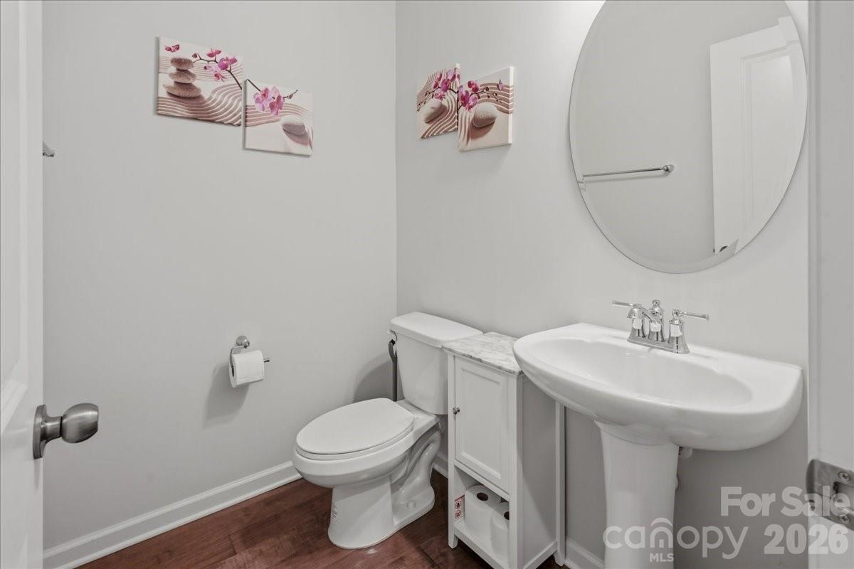 3001 Sterling Drive Waxhaw, NC 28173 - Photo 14 of 39 a bathroom with a toilet sink and mirror