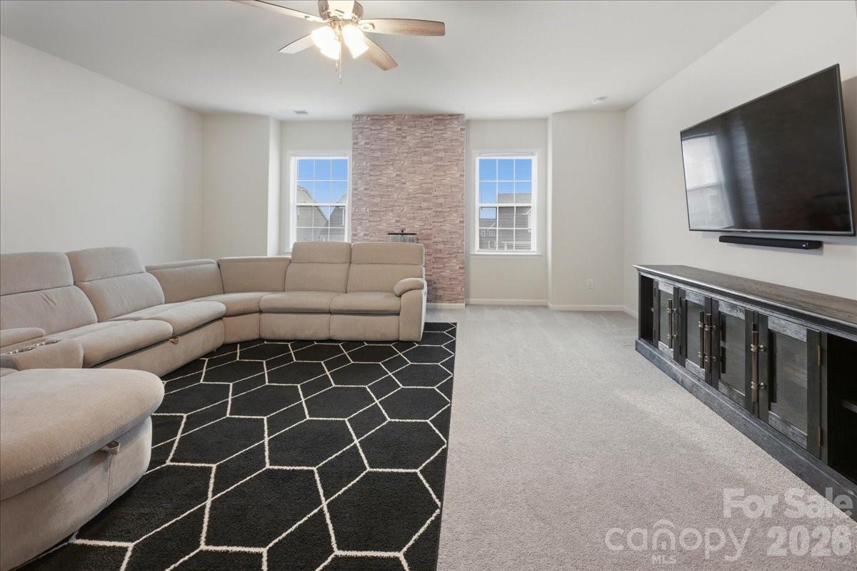 3001 Sterling Drive Waxhaw, NC 28173 - Photo 21 of 38 a living room with furniture and a flat screen tv