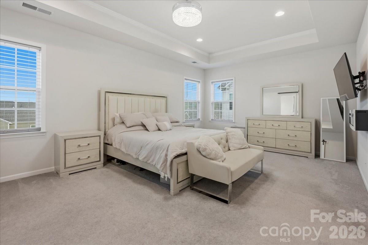 3001 Sterling Drive Waxhaw, NC 28173 - Photo 24 of 39 a spacious bedroom with a bed and a couch