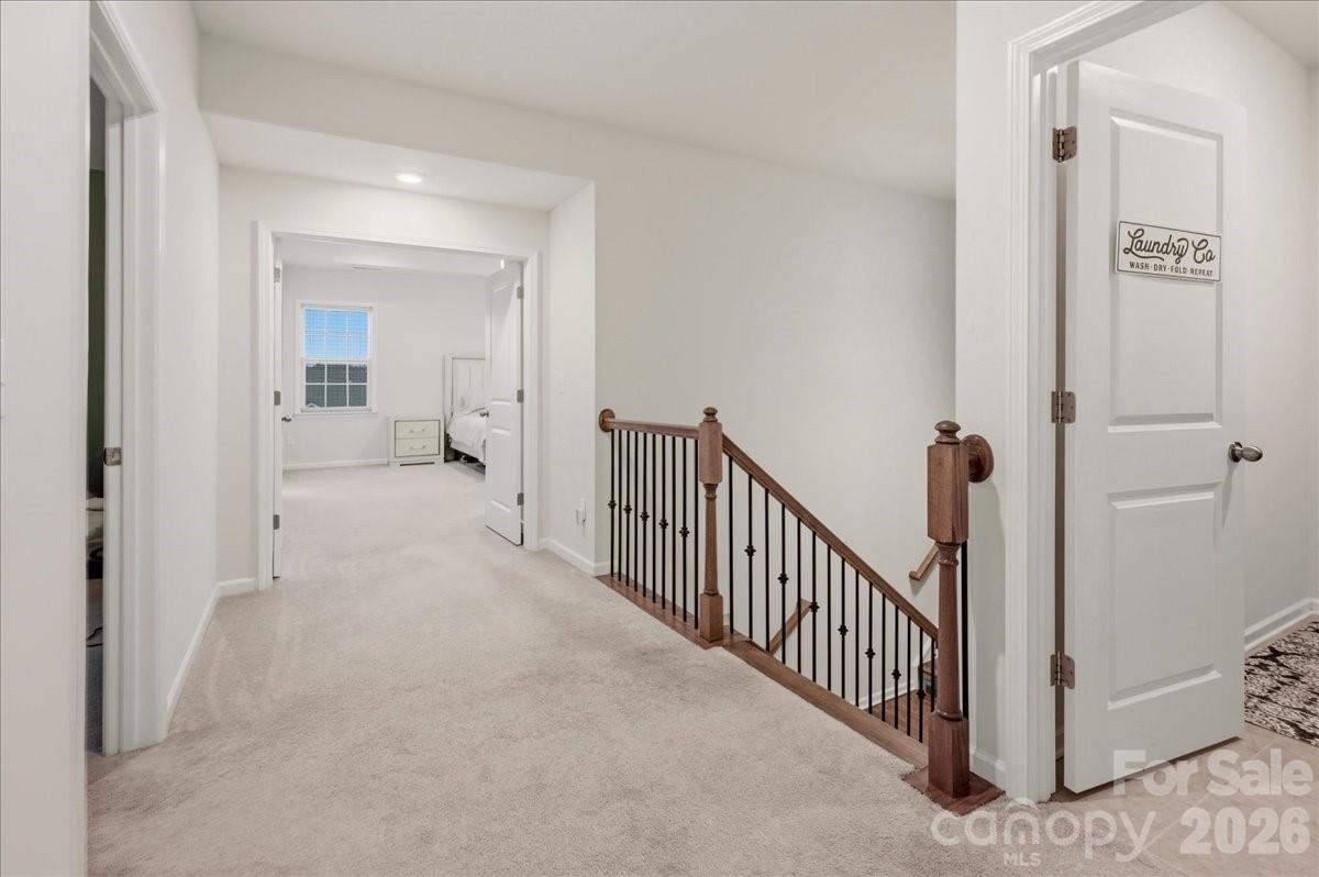 3001 Sterling Drive Waxhaw, NC 28173 - Photo 25 of 39 a view of a hallway with a livingroom and a bathroom