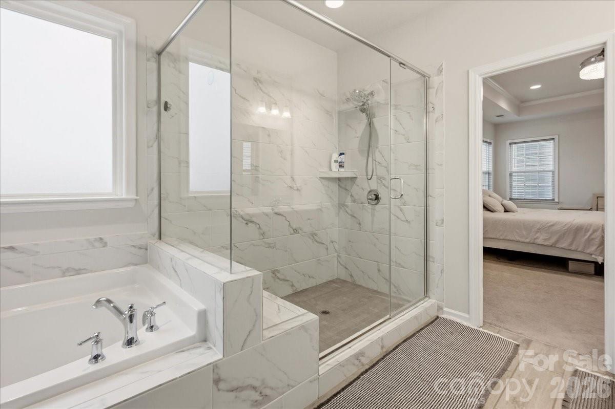 3001 Sterling Drive Waxhaw, NC 28173 - Photo 28 of 38 a bathroom with a bathtub and a shower